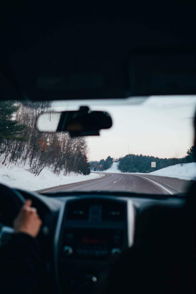 Driving the car down snowy roads