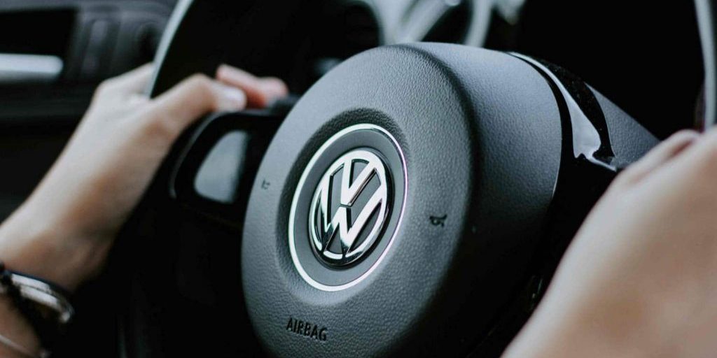 Volkswagen services logo on steering wheel.