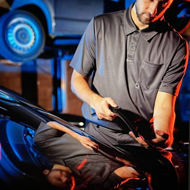 central audi staff completing an electric car MOT